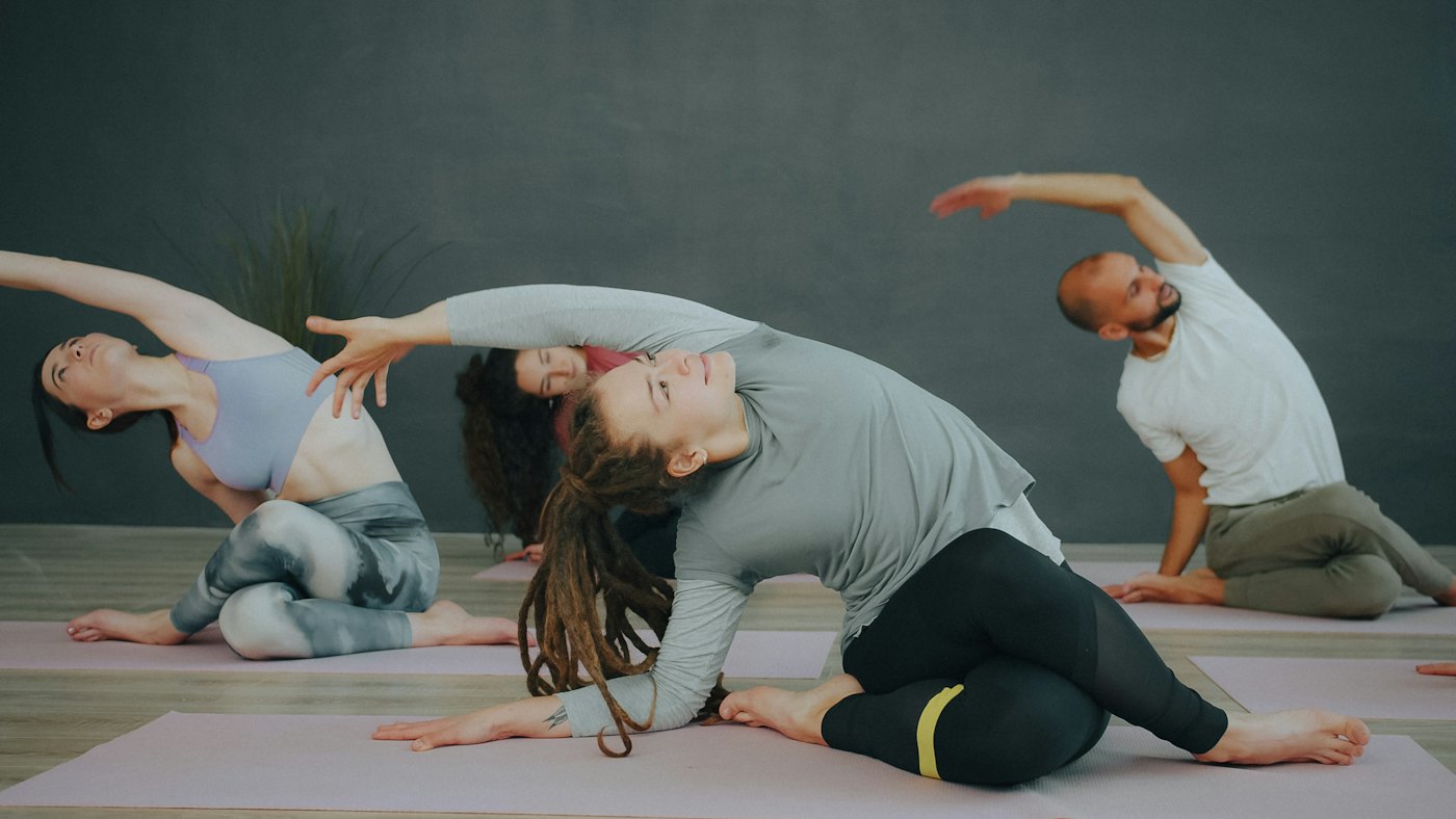 Stretching class on mats in a studio